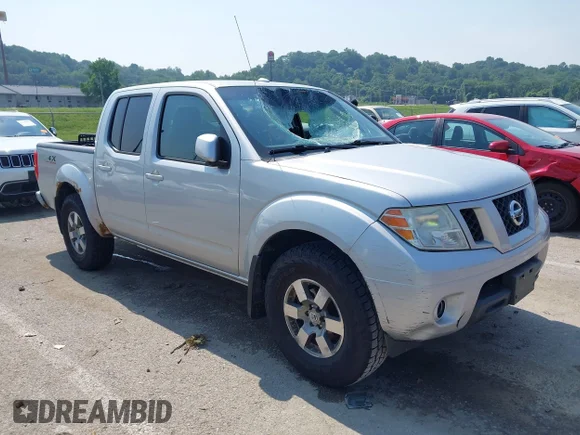 ✅ 2011 Nissan Frontier Pro-4X • VIN: 1N6AD0EV0BC415542 • Lot: 42455036. Listed on IAAI with 153,099 mi. Free auction sales archive from the USA and detailed vehicle history report at DreamBid. Image 1.
