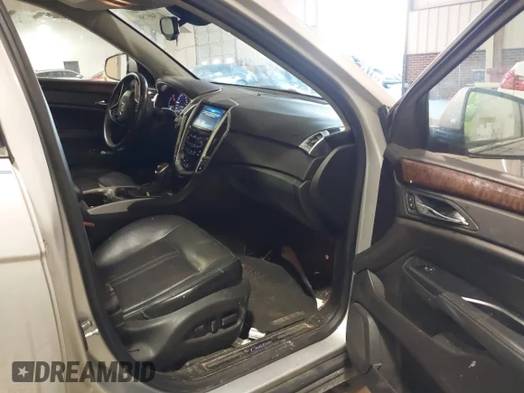 ✅ 2015 Cadillac SRX Premium Collection • VIN: 3GYFNDE32FS606966 • Lot: 41340756. Wystawiony na IAAI z przebiegiem 176 848 mil. Bezpłatny archiwum sprzedaży aukcyjnych z USA i szczegółowy raport historii pojazdu na DreamBid. Zdjęcie 5.