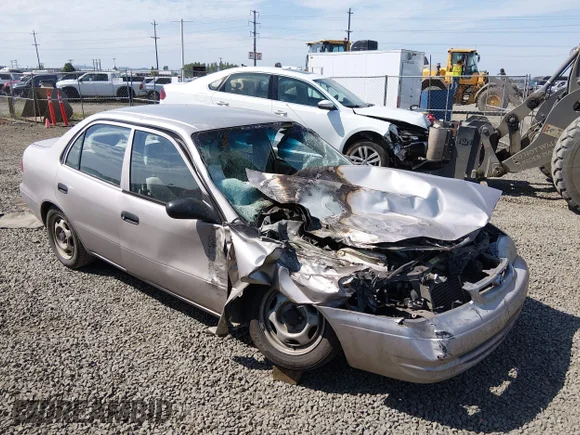 ✅ 2000 Toyota Corolla VE • VIN: 1NXBR12E1YZ364215 • Lot: 45229488. Listed on IAAI with 159,002 mi. Free auction sales archive from the USA and detailed vehicle history report at DreamBid. Image 1.