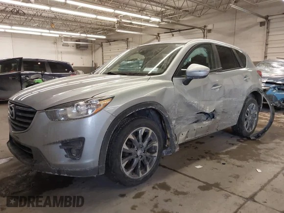✅ 2016 Mazda CX-5 Grand Touring • VIN: JM3KE4DY7G0680868 • Lot: 44203145. Listed on IAAI with 140,699 mi. Free auction sales archive from the USA and detailed vehicle history report at DreamBid. Image 6.