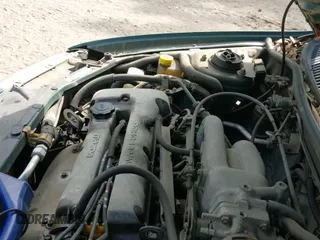 ✅ 1997 Mazda Protege DX • VIN: JM1BC1418V0112707 • Lot: 42202679. Listed on IAAI with Not provided. Free auction sales archive from the USA and detailed vehicle history report at DreamBid. Image 12.