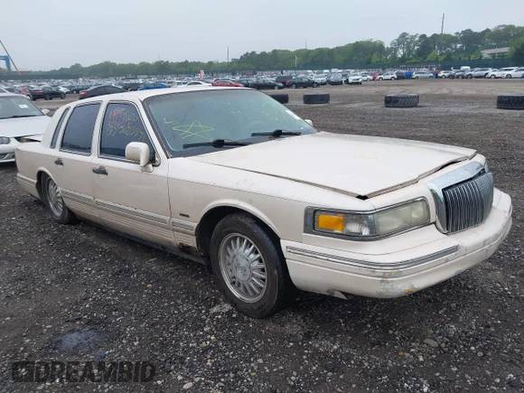 ✅ 1996 Lincoln Town Car Cartier • VIN: 1LNLM83W6TY673652 • Lot: 42414169. Listed on IAAI with Not provided. Free auction sales archive from the USA and detailed vehicle history report at DreamBid. Image 1.