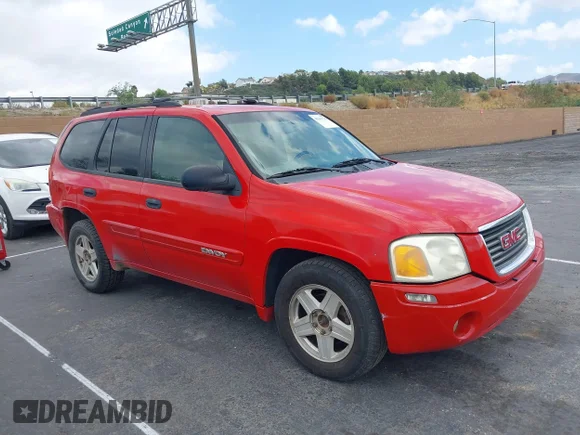 ✅ 2002 GMC Envoy SLT • VIN: 1GKDT13S022455969 • Lot: 43389740. Listed on IAAI with 303,212 mi. Free auction sales archive from the USA and detailed vehicle history report at DreamBid. Image 1.