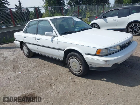 ✅ 1990 Toyota Camry • VIN: 4T1VV22E0LU007387 • Lot: 45061670. Listed on IAAI with 181,596 mi. Free auction sales archive from the USA and detailed vehicle history report at DreamBid. Image 1.