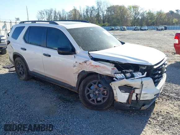 ✅ 2025 Honda Pilot TrailSport • VIN: 5FNYG1H61SB018539 • Lot: 44561169. Listed on IAAI with 40,210 mi. Free auction sales archive from the USA and detailed vehicle history report at DreamBid. Image 1.