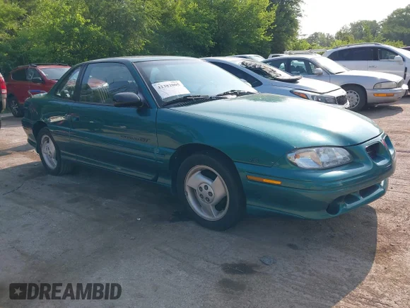 ✅ 1996 Pontiac Grand Am • VIN: 1G2NW12M6TC782385 • Lot: 42382005. Listed on IAAI with 119,751 mi. Free auction sales archive from the USA and detailed vehicle history report at DreamBid. Image 1.