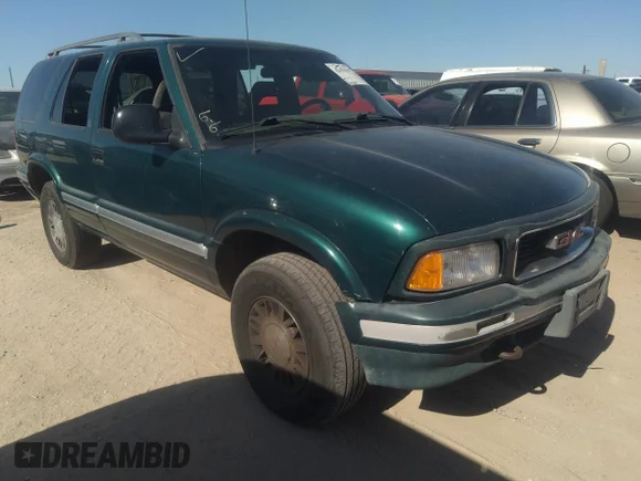 ✅ 1997 GMC Jimmy SLS • VIN: 1GKDT13W1V2544957 • Lot: 42456017. Listed on IAAI with 143,223 mi. Free auction sales archive from the USA and detailed vehicle history report at DreamBid. Image 1.