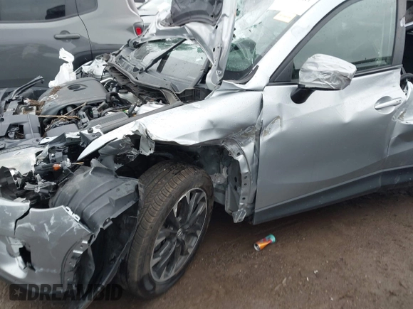 ✅ 2016 Mazda CX-5 Grand Touring • VIN: JM3KE4DY0G0601640 • Lot: 43595381. Wystawiony na IAAI z przebiegiem Nie podano. Bezpłatny archiwum sprzedaży aukcyjnych z USA i szczegółowy raport historii pojazdu na DreamBid. Zdjęcie 6.