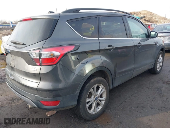 ✅ 2017 Ford Escape SE • VIN: 1FMCU9GD5HUA56966 • Lot: 44662803. Wystawiony na IAAI z przebiegiem 100 987 mil. Bezpłatny archiwum sprzedaży aukcyjnych z USA i szczegółowy raport historii pojazdu na DreamBid. Zdjęcie 4.