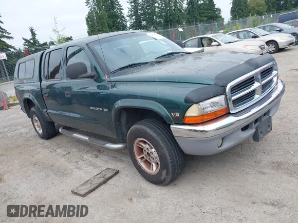 ✅ 2000 Dodge Dakota Sport • VIN: 1B7GG2AN4YS760836 • Lot: 42472312. Listed on IAAI with 230,401 mi. Free auction sales archive from the USA and detailed vehicle history report at DreamBid. Image 1.