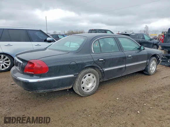 ✅ 2002 Lincoln Continental • VIN: 1LNHM97V72Y600639 • Lot: 48840856. Wystawiony na Copart z przebiegiem Nie podano. Bezpłatny archiwum sprzedaży aukcyjnych z USA i szczegółowy raport historii pojazdu na DreamBid. Zdjęcie 3.