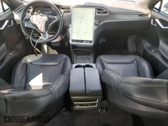 ✅ 2016 Tesla Model S 90D • VIN: 5YJSA1E20GF128904 • Lot: 65140654. Listed on Copart with 85,086 mi. Free auction sales archive from the USA and detailed vehicle history report at DreamBid. Image 8.