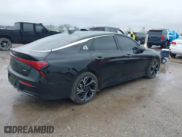 ✅ 2025 Kia K5 GT-Line • VIN: KNAG64J78S5284707 • Lot: 41555441. Wystawiony na IAAI z przebiegiem 14 456 mil. Bezpłatny archiwum sprzedaży aukcyjnych z USA i szczegółowy raport historii pojazdu na DreamBid. Zdjęcie 4.