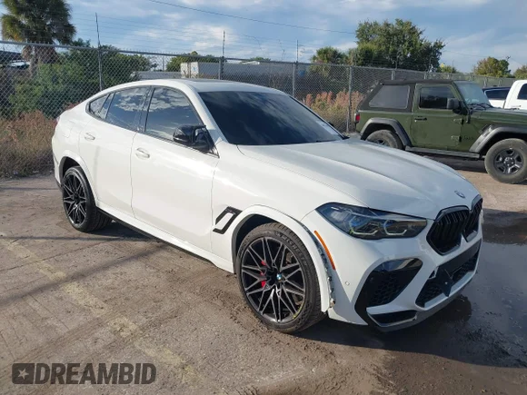 ✅ 2022 BMW X6 M • VIN: 5YMCY0C05N9J59690 • Lot: 44076490. Listed on IAAI with 35,597 mi. Free auction sales archive from the USA and detailed vehicle history report at DreamBid. Image 1.