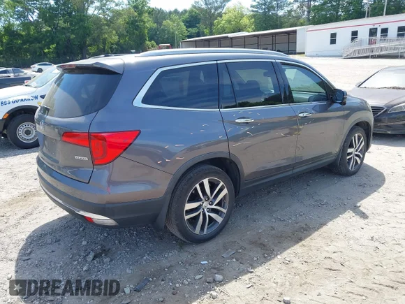 ✅ 2017 Honda Pilot Touring • VIN: 5FNYF5H90HB013829 • Lot: 45136496. Listed on IAAI with 217,241 mi. Free auction sales archive from the USA and detailed vehicle history report at DreamBid. Image 4.