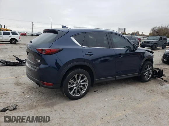 ✅ 2021 Mazda CX-5 Signature • VIN: JM3KFBEY5M0346432 • Лот: 68391012. Опубліковано раніше на Copart з пробігом Не вказано. Безкоштовний доступ до архіву аукціонних продажів зі США та докладний звіт про історію автомобіля на DreamBid. Зображення 3.