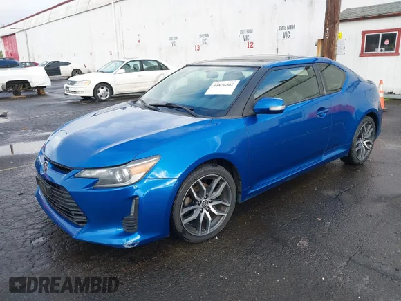 ✅ 2014 Scion tC • VIN: JTKJF5C79E3081376 • Lot: 44876862. Wystawiony na IAAI z przebiegiem 128 085 mil. Bezpłatny archiwum sprzedaży aukcyjnych z USA i szczegółowy raport historii pojazdu na DreamBid. Zdjęcie 2.
