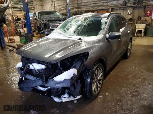 ✅ 2021 Ford Escape Titanium Hybrid • VIN: 1FMCU9DZ0MUB20602 • Lot: 73835875. Wystawiony na Copart z przebiegiem 74 756 km. Bezpłatny archiwum sprzedaży aukcyjnych z USA i szczegółowy raport historii pojazdu na DreamBid. Zdjęcie 1.