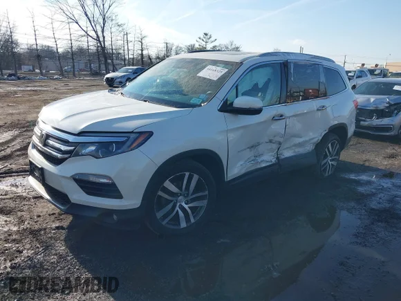 ✅ 2018 Honda Pilot Touring • VIN: 5FNYF6H90JB029797 • Lot: 44168325. Listed on IAAI with 164,149 mi. Free auction sales archive from the USA and detailed vehicle history report at DreamBid. Image 2.