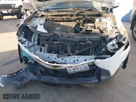 ✅ 2015 Mazda CX-5 Touring • VIN: JM3KE2CY0F0518214 • Lot: 44573630. Listed on IAAI with 130,983 mi. Free auction sales archive from the USA and detailed vehicle history report at DreamBid. Image 6.