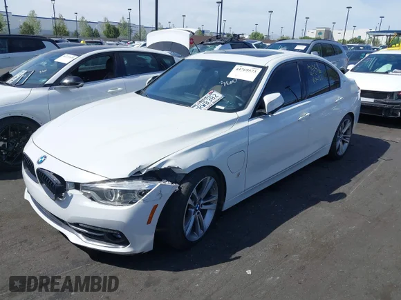 ✅ 2018 BMW 3 Series 330e • VIN: WBA8E1C57JA758475 • Lot: 44769573. Listed on IAAI with 123,406 mi. Free auction sales archive from the USA and detailed vehicle history report at DreamBid. Image 2.