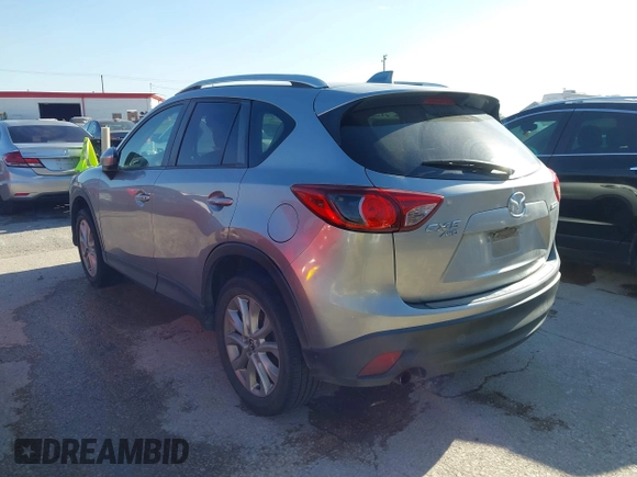 ✅ 2014 Mazda CX-5 Grand Touring • VIN: JM3KE4DY2E0384881 • Lot: 44487246. Wystawiony na IAAI z przebiegiem 266 155 mil. Bezpłatny archiwum sprzedaży aukcyjnych z USA i szczegółowy raport historii pojazdu na DreamBid. Zdjęcie 3.