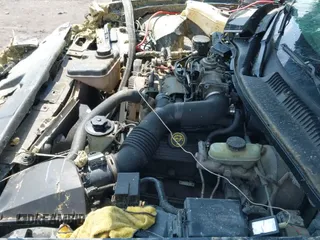 ✅ 1999 Lincoln Town Car Cartier • VIN: 1LNHM83W0XY673738 • Lot: 42437877. Listed on IAAI with 143,018 mi. Free auction sales archive from the USA and detailed vehicle history report at DreamBid. Image 20.