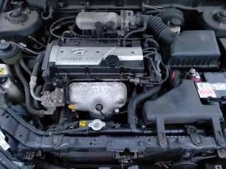 2004 Hyundai Accent GL with VIN KMHCG35CX4U312284, listed as a Copart auction lot 83992384 with 88,786 mi miles and Salvage title. Bid and sale history available at DreamBid. Image 13.