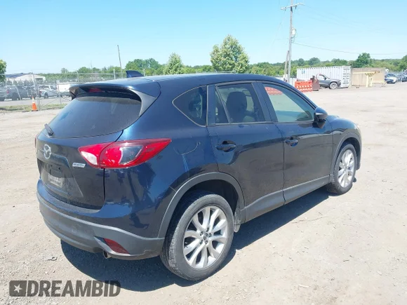✅ 2015 Mazda CX-5 Grand Touring • VIN: JM3KE2DY7F0501991 • Lot: 45290156. Wystawiony na IAAI z przebiegiem 193 720 mil. Bezpłatny archiwum sprzedaży aukcyjnych z USA i szczegółowy raport historii pojazdu na DreamBid. Zdjęcie 4.
