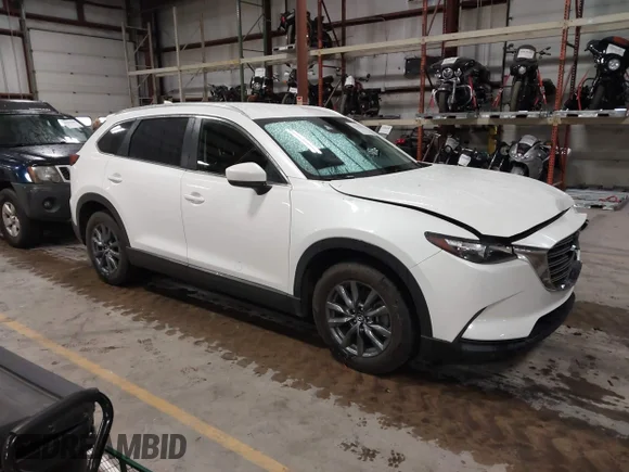 ✅ 2022 Mazda CX-9 Sport • VIN: JM3TCBBYXN0603653 • Лот: 42325893. Опубліковано раніше на IAAI з пробігом 57 480 миль. Безкоштовний доступ до архіву аукціонних продажів зі США та докладний звіт про історію автомобіля на DreamBid. Зображення 1.