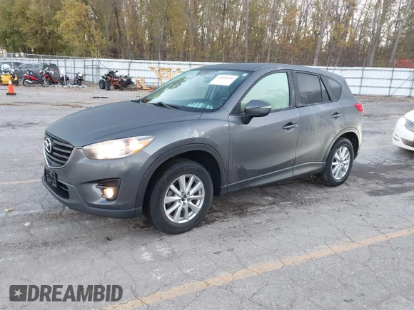 ✅ 2016 Mazda CX-5 Touring • VIN: JM3KE4CYXG0654394 • Лот: 43568490. Опубликован ранее на IAAI с пробегом 101 377 миль. Бесплатный доступ к архиву аукционных продаж из США и подробный отчёт об истории автомобиля на DreamBid. Изображение 2.