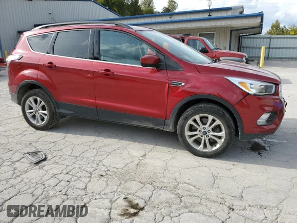 ✅ 2018 Ford Escape SE • VIN: 1FMCU9GD1JUB05635 • Lot: 69739633. Listed on Copart with 54,959 mi. Free auction sales archive from the USA and detailed vehicle history report at DreamBid. Image 4.
