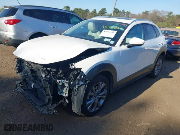 ✅ 2021 Mazda CX-30 Premium • VIN: 3MVDMBDM0MM237278 • Лот: 42050766. Опубліковано раніше на IAAI з пробігом 63 813 миль. Безкоштовний доступ до архіву аукціонних продажів зі США та докладний звіт про історію автомобіля на DreamBid. Зображення 2.