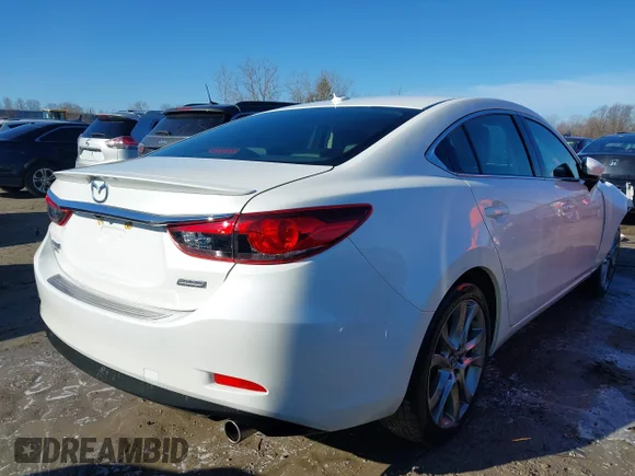 ✅ 2014 Mazda 6 i Grand Touring • VIN: JM1GJ1W65E1159529 • Лот: 41849161. Опубліковано раніше на IAAI з пробігом 124 567 миль. Безкоштовний доступ до архіву аукціонних продажів зі США та докладний звіт про історію автомобіля на DreamBid. Зображення 4.