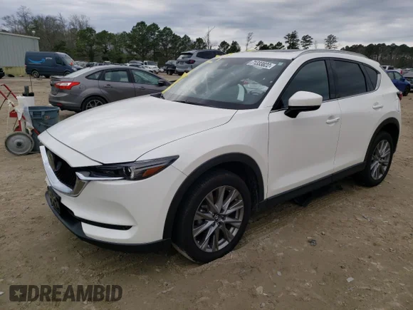✅ 2021 Mazda CX-5 Grand Touring • VIN: JM3KFBDM3M1458204 • Lot: 71333822. Wystawiony na Copart z przebiegiem 13 030 mil. Bezpłatny archiwum sprzedaży aukcyjnych z USA i szczegółowy raport historii pojazdu na DreamBid. Zdjęcie 1.