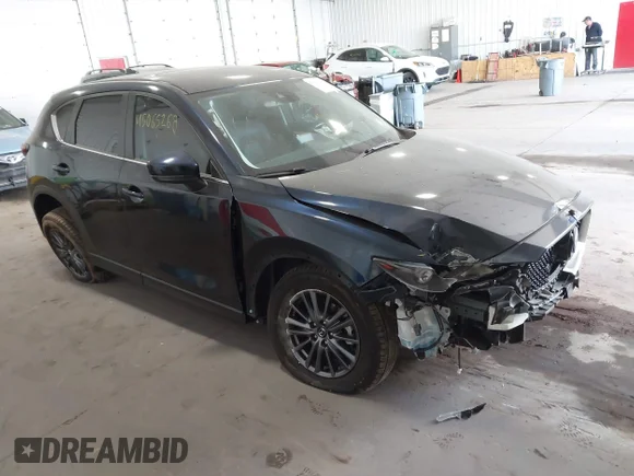 ✅ 2021 Mazda CX-5 Touring • VIN: JM3KFBCM0M1334943 • Lot: 45065268. Listed on IAAI with 67,813 mi. Free auction sales archive from the USA and detailed vehicle history report at DreamBid. Image 1.