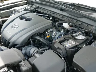 ✅ 2024 Mazda CX-50 S Premium • VIN: 7MMVABDM6RN238477 • Лот: 42720336. Опубликован ранее на IAAI с пробегом 6 319 миль. Бесплатный доступ к архиву аукционных продаж из США и подробный отчёт об истории автомобиля на DreamBid. Изображение 19.