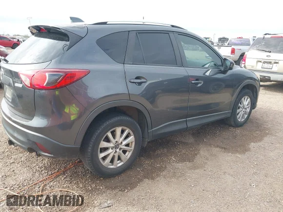 ✅ 2014 Mazda CX-5 Touring • VIN: JM3KE2CY3E0407607 • Lot: 44197501. Wystawiony na IAAI z przebiegiem 197 868 mil. Bezpłatny archiwum sprzedaży aukcyjnych z USA i szczegółowy raport historii pojazdu na DreamBid. Zdjęcie 4.