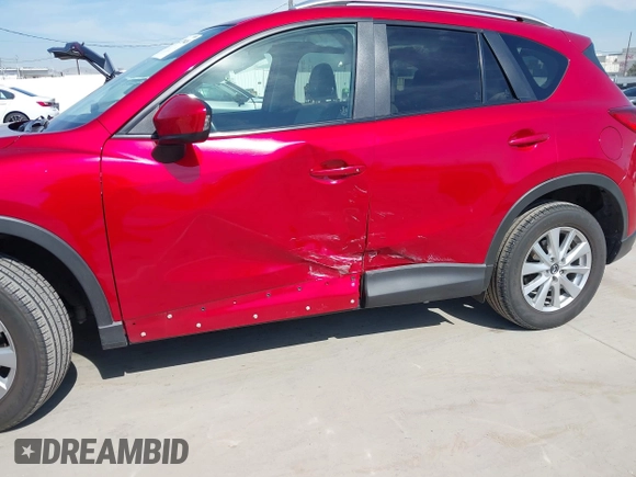 ✅ 2014 Mazda CX-5 Touring • VIN: JM3KE2CY3E0415576 • Lot: 44473948. Wystawiony na IAAI z przebiegiem 73 868 mil. Bezpłatny archiwum sprzedaży aukcyjnych z USA i szczegółowy raport historii pojazdu na DreamBid. Zdjęcie 6.