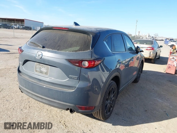 ✅ 2021 Mazda CX-5 Carbon Edition • VIN: JM3KFACY8M0381768 • Lot: 44000802. Wystawiony na IAAI z przebiegiem 82 111 mil. Bezpłatny archiwum sprzedaży aukcyjnych z USA i szczegółowy raport historii pojazdu na DreamBid. Zdjęcie 4.