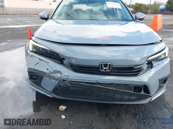 ✅ 2023 Honda Civic Touring • VIN: 2HGFE1F94PH300428 • Lot: 41585118. Wystawiony na IAAI z przebiegiem 30 772 mil. Bezpłatny archiwum sprzedaży aukcyjnych z USA i szczegółowy raport historii pojazdu na DreamBid. Zdjęcie 6.