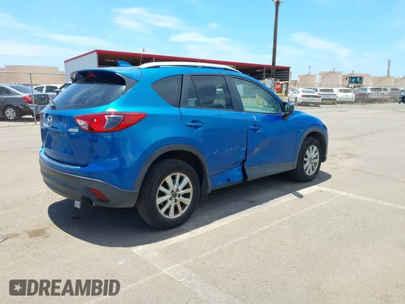 ✅ 2014 Mazda CX-5 Touring • VIN: JM3KE2CY3E0304638 • Lot: 44863250. Wystawiony na IAAI z przebiegiem 90 713 mil. Bezpłatny archiwum sprzedaży aukcyjnych z USA i szczegółowy raport historii pojazdu na DreamBid. Zdjęcie 4.