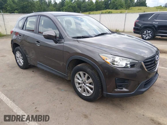 ✅ 2016 Mazda CX-5 Sport • VIN: JM3KE2BY7G0799267 • Lot: 45361178. Listed on IAAI with 108,359 mi. Free auction sales archive from the USA and detailed vehicle history report at DreamBid. Image 1.