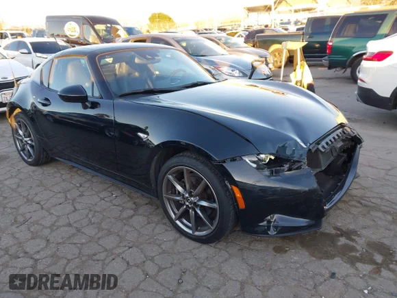 ✅ 2023 Mazda MX-5 Miata Grand Touring • VIN: JM1NDAM79P0558317 • Lot: 44120030. Listed on IAAI with 15,568 mi. Free auction sales archive from the USA and detailed vehicle history report at DreamBid. Image 1.