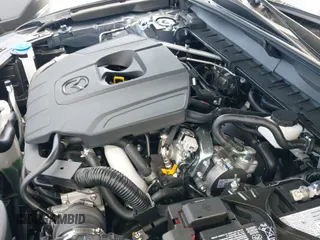 ✅ 2025 Mazda CX-50 S Preferred • VIN: 7MMVABBM1SN392085 • Lot: 43723950. Listed on IAAI with 1,452 mi. Free auction sales archive from the USA and detailed vehicle history report at DreamBid. Image 20.