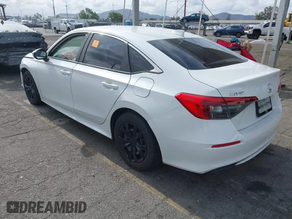 ✅ 2022 Honda Civic LX • VIN: 2HGFE2F28NH523089 • Lot: 45016001. Listed on IAAI with 124,535 mi. Free auction sales archive from the USA and detailed vehicle history report at DreamBid. Image 3.