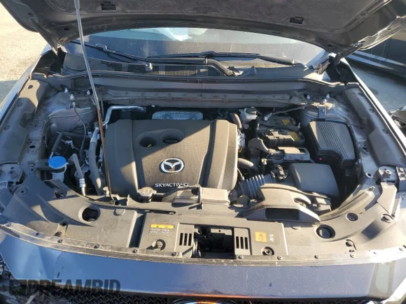 ✅ 2021 Mazda CX-5 Grand Touring • VIN: JM3KFBDM3M1384315 • Лот: 70354552. Опубліковано раніше на Copart з пробігом 23 961 миль. Безкоштовний доступ до архіву аукціонних продажів зі США та докладний звіт про історію автомобіля на DreamBid. Зображення 12.