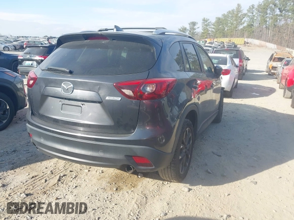 ✅ 2016 Mazda CX-5 Grand Touring • VIN: JM3KE4DYXG0833565 • Lot: 44305458. Wystawiony na IAAI z przebiegiem 123 654 mil. Bezpłatny archiwum sprzedaży aukcyjnych z USA i szczegółowy raport historii pojazdu na DreamBid. Zdjęcie 4.