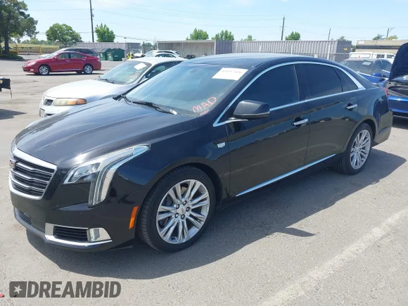 ✅ 2018 Cadillac XTS Luxury • VIN: 2G61M5S34J9129608 • Lot: 45157426. Listed on IAAI with 97,419 mi. Free auction sales archive from the USA and detailed vehicle history report at DreamBid. Image 2.