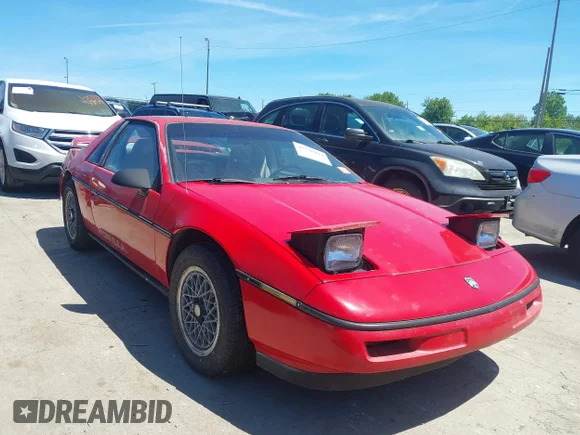 ✅ 1988 Pontiac Fiero • VIN: 1G2PE1191JP223888 • Lot: 45236834. Wystawiony na IAAI z przebiegiem 177 170 mil. Bezpłatny archiwum sprzedaży aukcyjnych z USA i szczegółowy raport historii pojazdu na DreamBid. Zdjęcie 1.